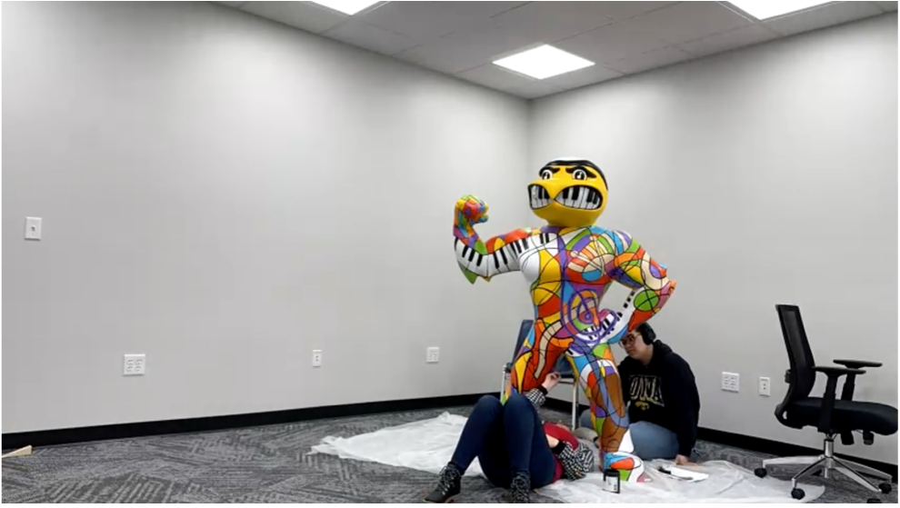 Rachel and Sadé work on the fine lines of Herky.